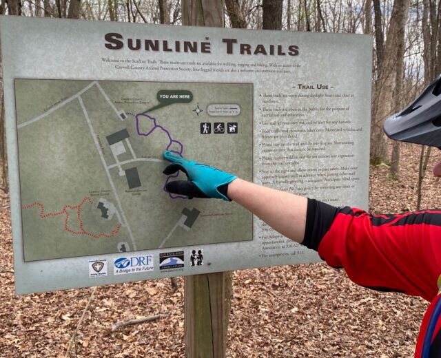 Mike Wilkins examines the map for the Sunline Trail