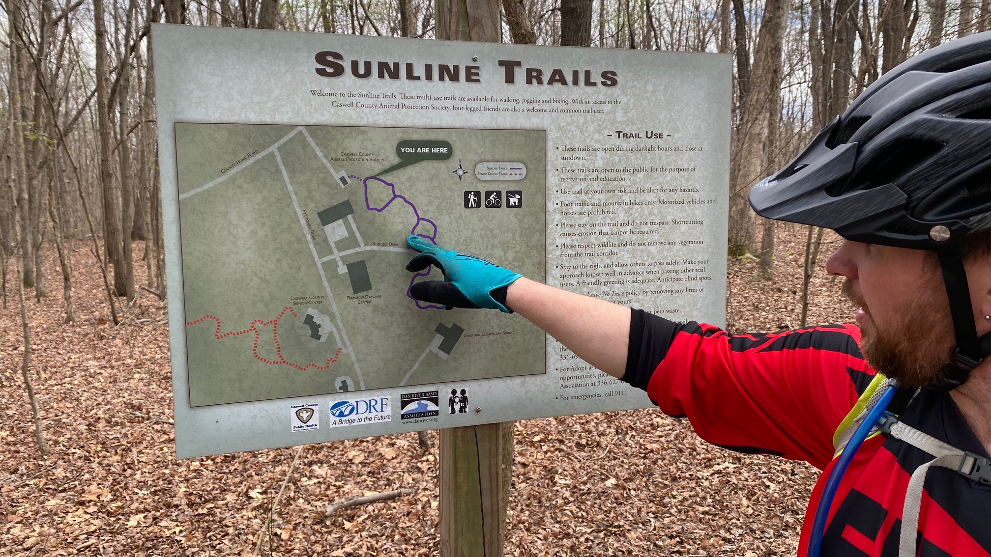 Mike Wilkins examines the map for the Sunline Trail